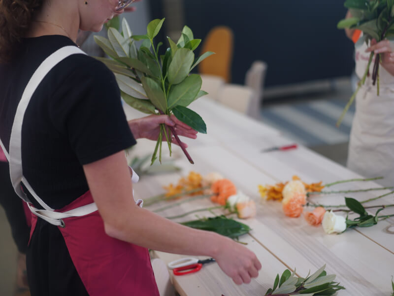 A table full of flowers for a floral arranging class.