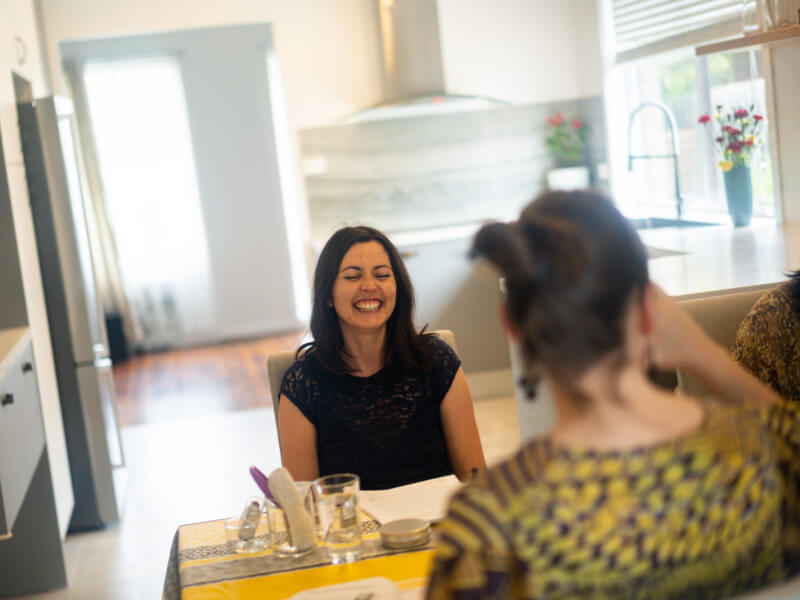 Woman smiling at a hen party soap making class.