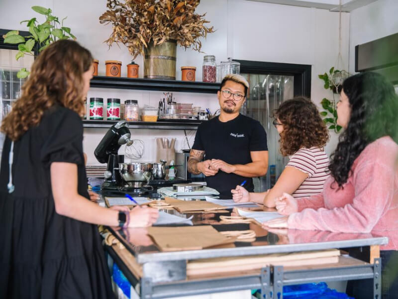 A group of people enjoying a baking class together