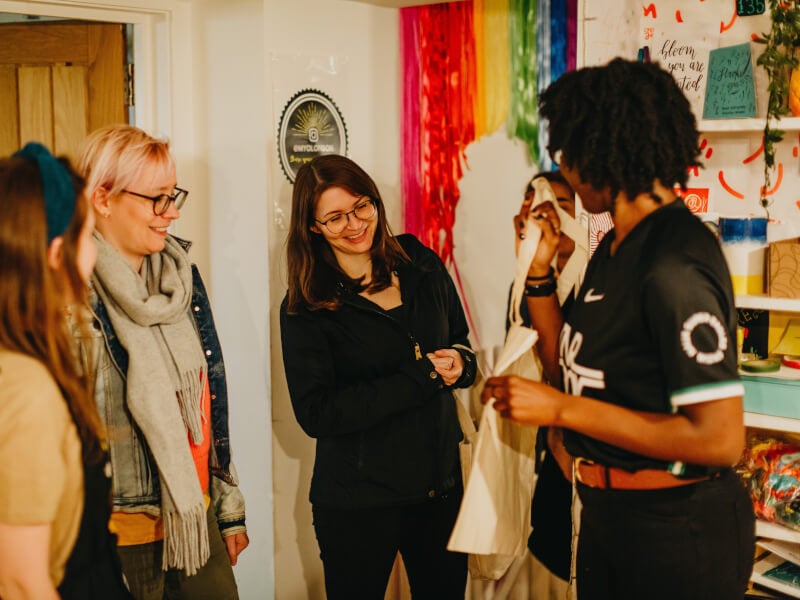 A group of students chatting at a lino printing class