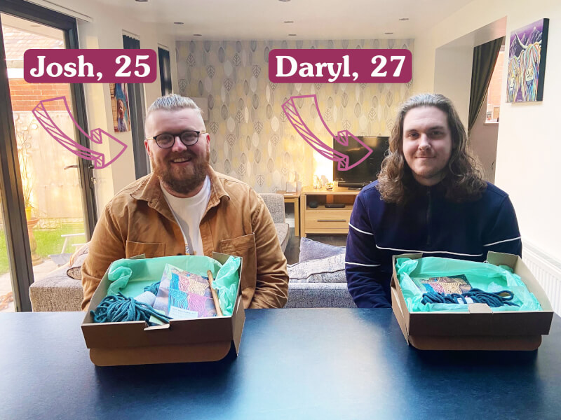 Two men sit behind macrame craft boxes containing yarn and hooks as they prepare to learn to macrame