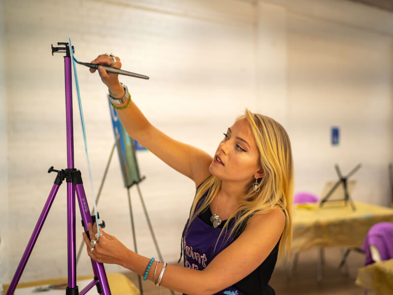 Artist teaching a painting class.