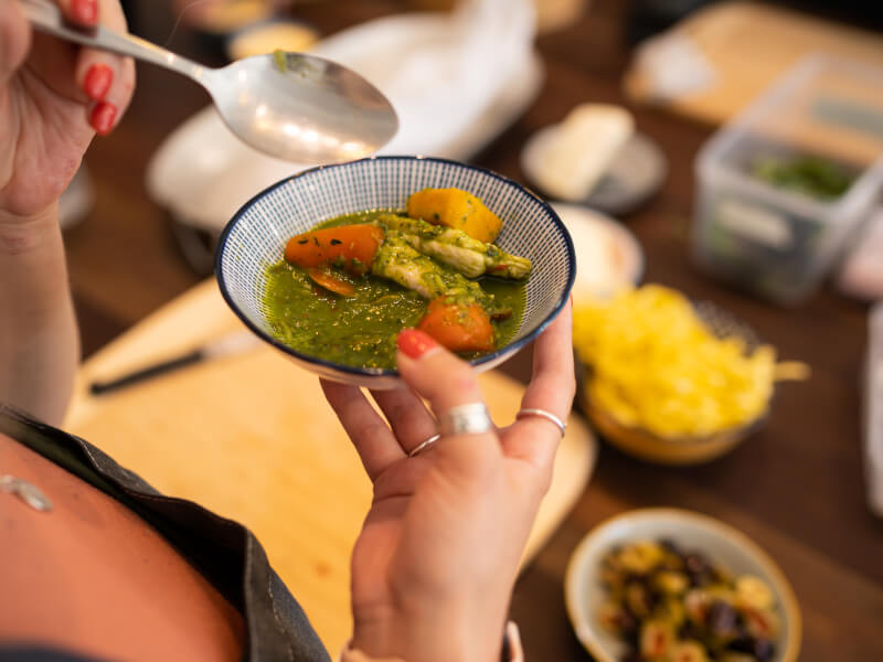 A close up of Asian food in a small blue and white patterned bowl