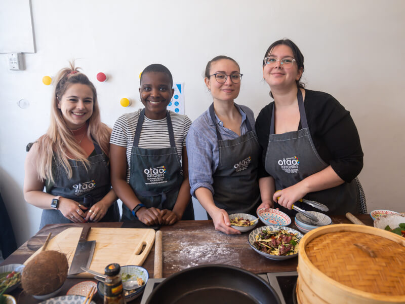 Group of women at a hen party cooking class in Manchester.