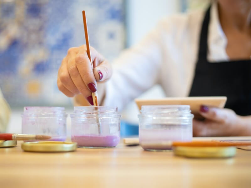 A woman trying out a painting class.