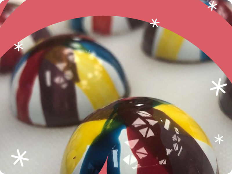 close up shot of colourful lacquered chocolate truffles