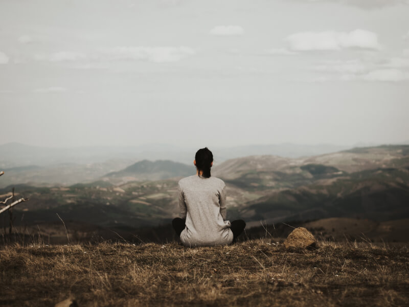 A person practicing yoga meditation outdoors
