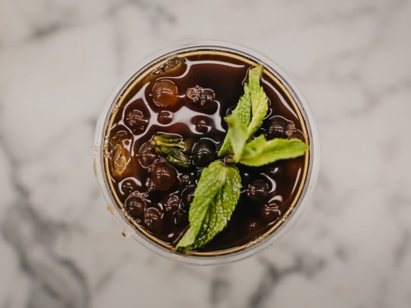 Close up overhead shot of a glass filled with iced tea