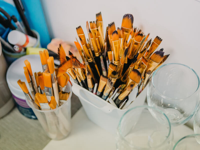 A pot of paintbrushes.
