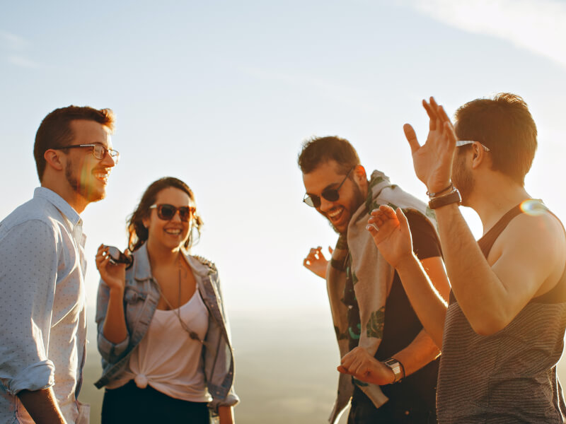 A group of people laughing and dancing