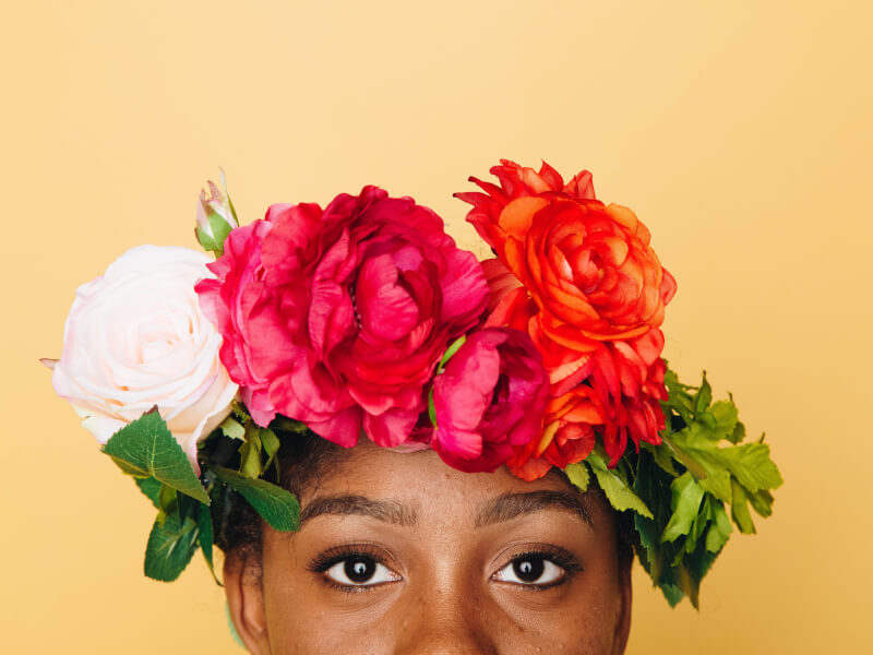 A DIY flower crown resting on a person's head