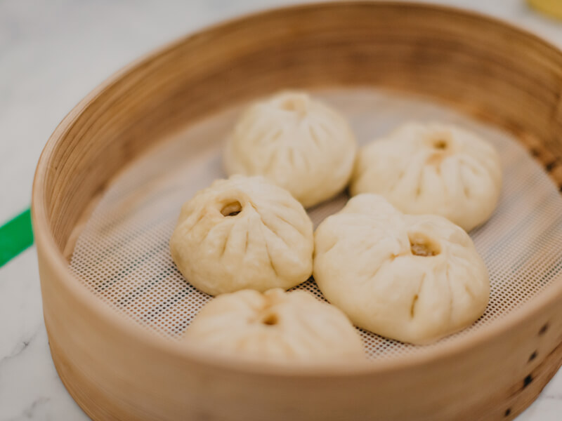 Bao buns in a steamer at a cooking class