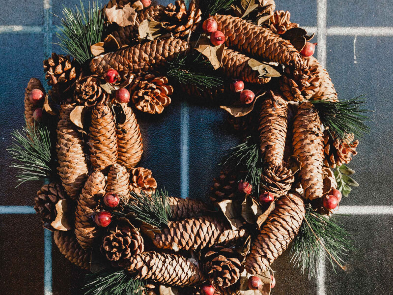 A handmade christmas wreath hanging on a wall