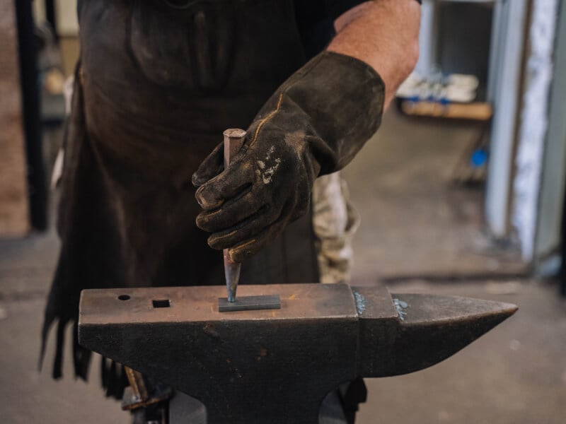Man in a blacksmithing class