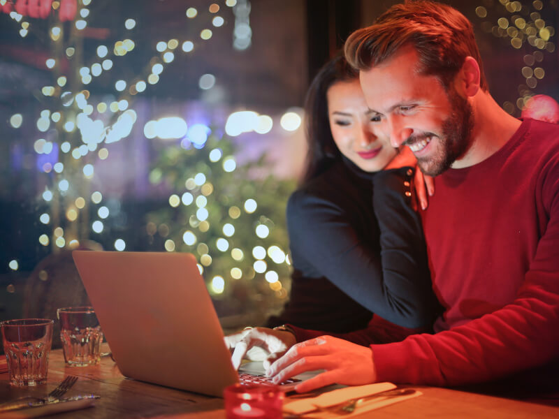 A couple taking part in an online virual christmas activity