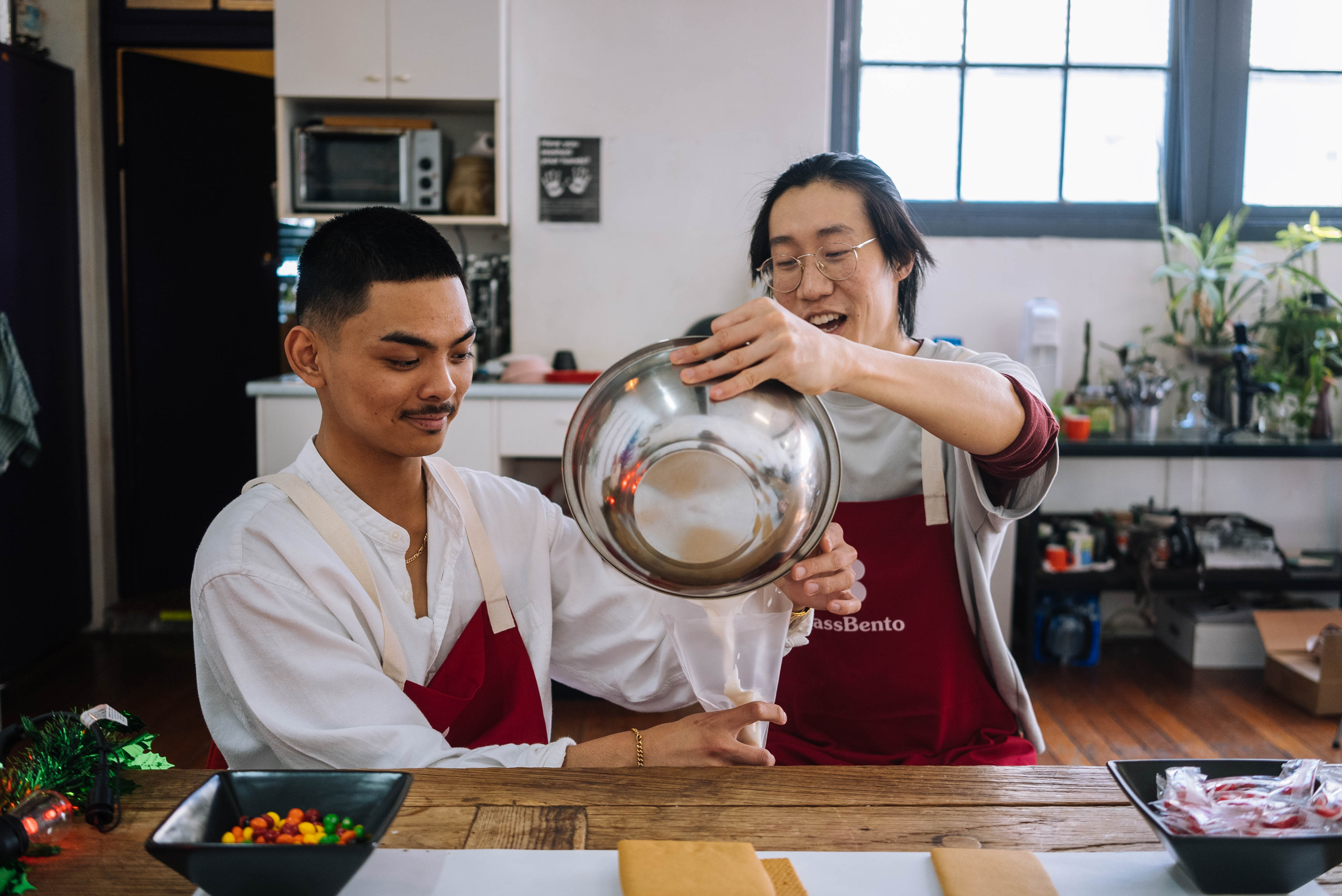 Two men are making handmade soy candles as a date night activity
