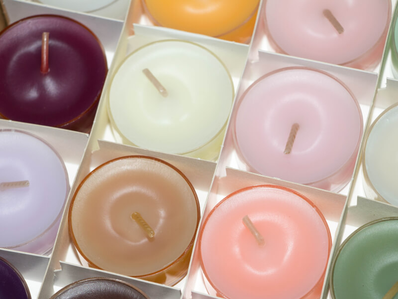 Several tea light candles inside a box