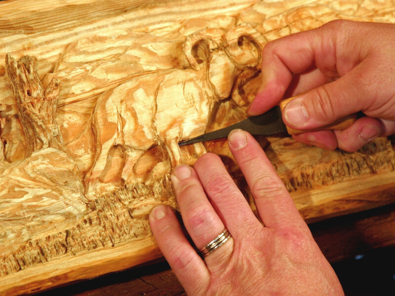 A wood carving of an elephant.