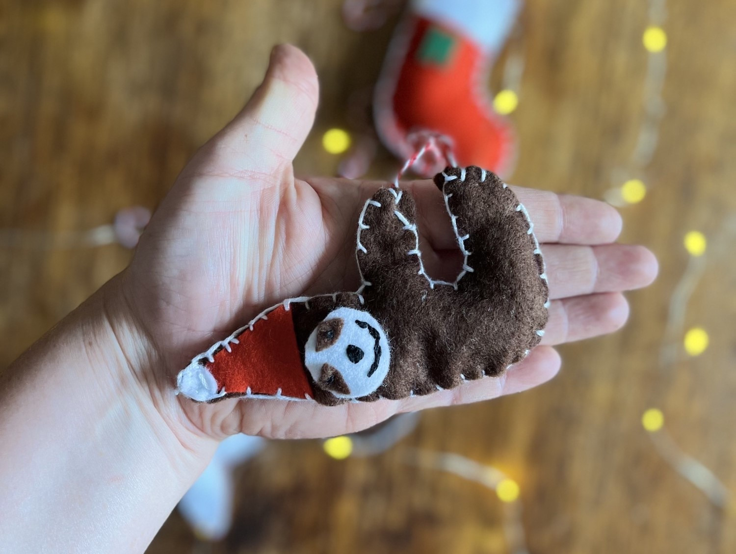 A closeup of someone holding a DIY Christmas decoration.