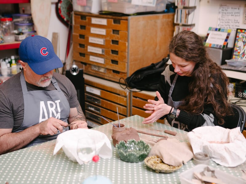 Father and daughter in a pottery class