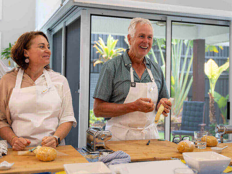 Man smiling in a cooking class