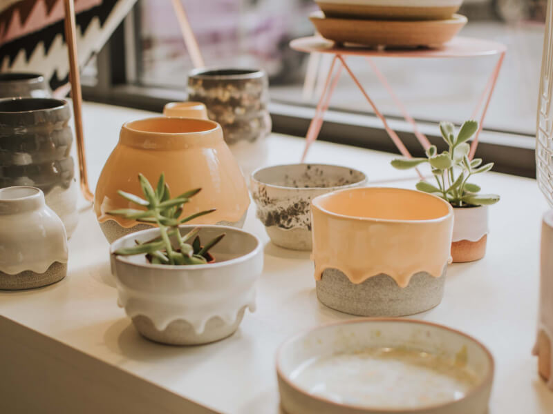 Several pieces of handmade pottery placed on a table