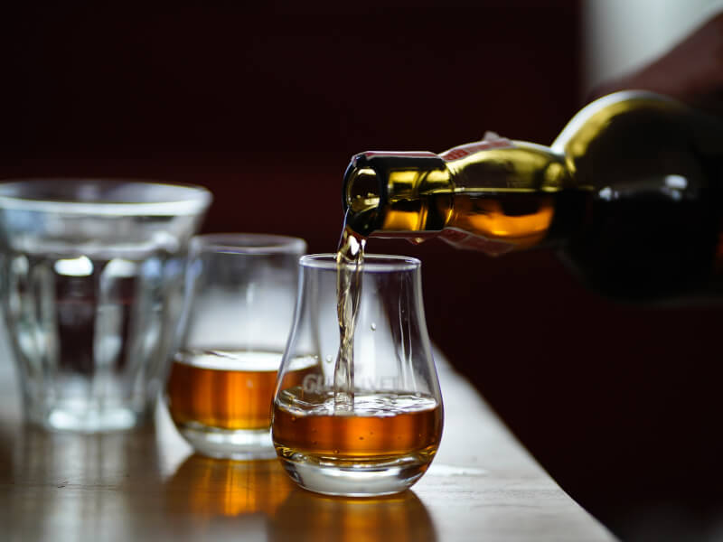 Whisky being poured into a whisky glass