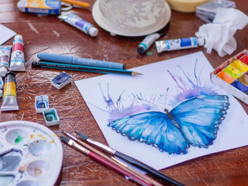 A painted butterfly made using watercolor painting techniques