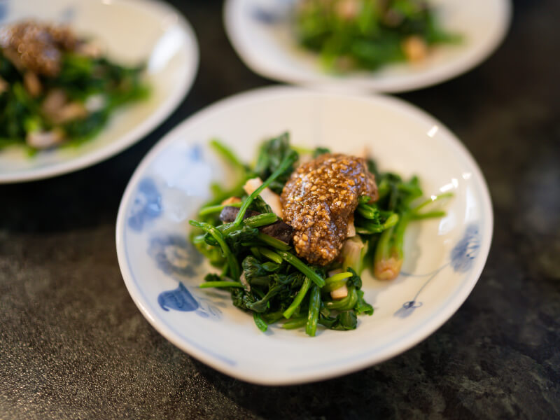 A finished dish of Persian food on a blue and white plate