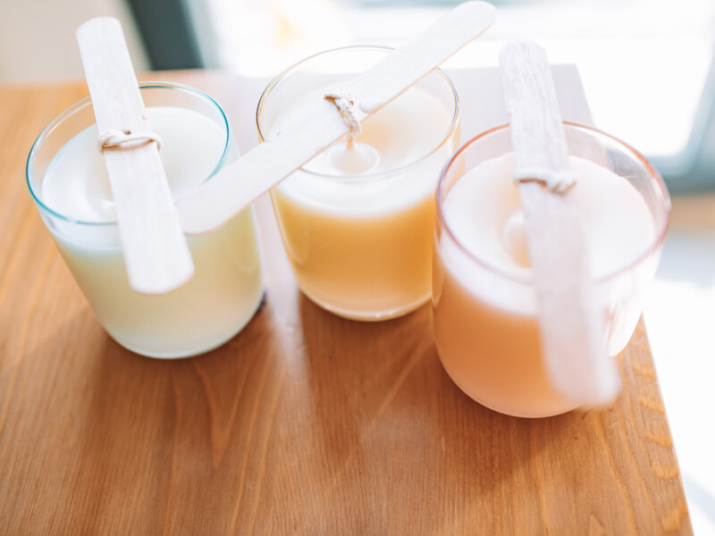 Three homemade soy candles made with a candle making kit.
