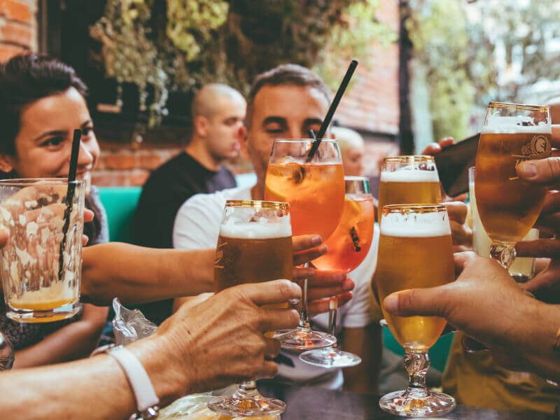 A group of people raising their glasses together