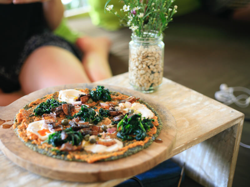 Homemade spinach and egg pizza - made in a virtual team cooking class.