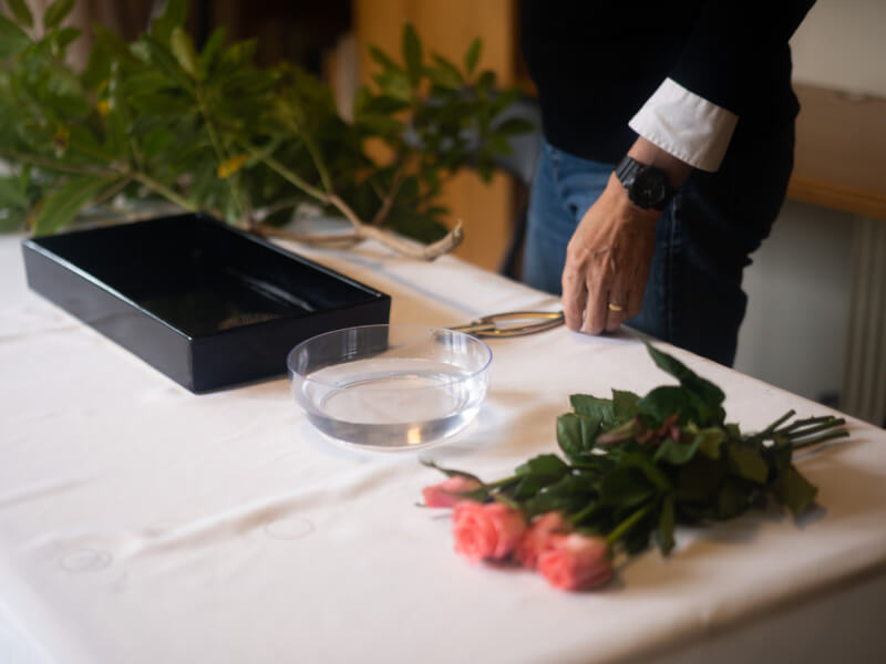 A close up of ikebana equipment laid out on a table