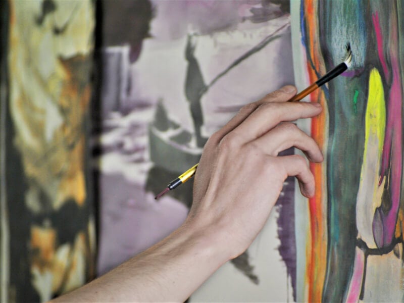 woman painting at a group art class