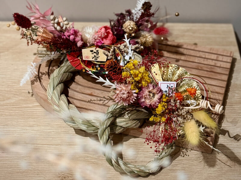 Two finished Japanese shimenawa on a table