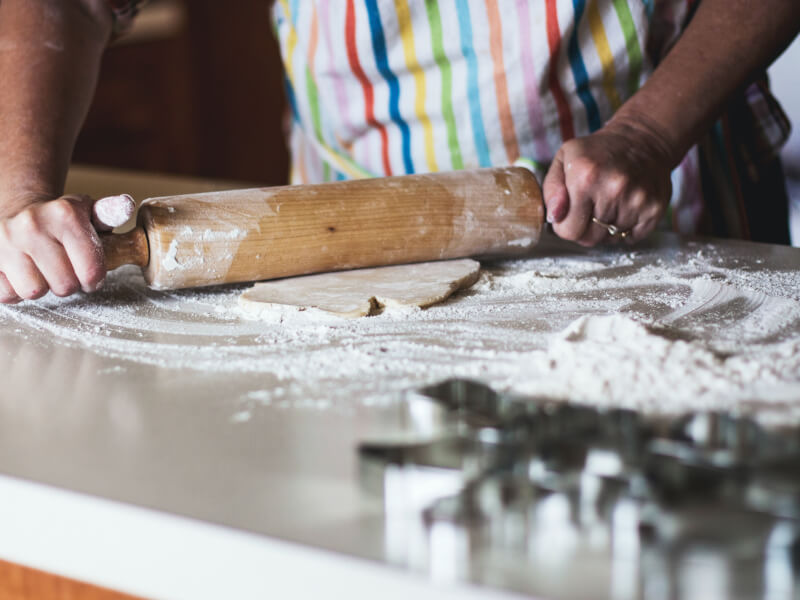 Getting ready for pizza dough making with flour and a rolling pin