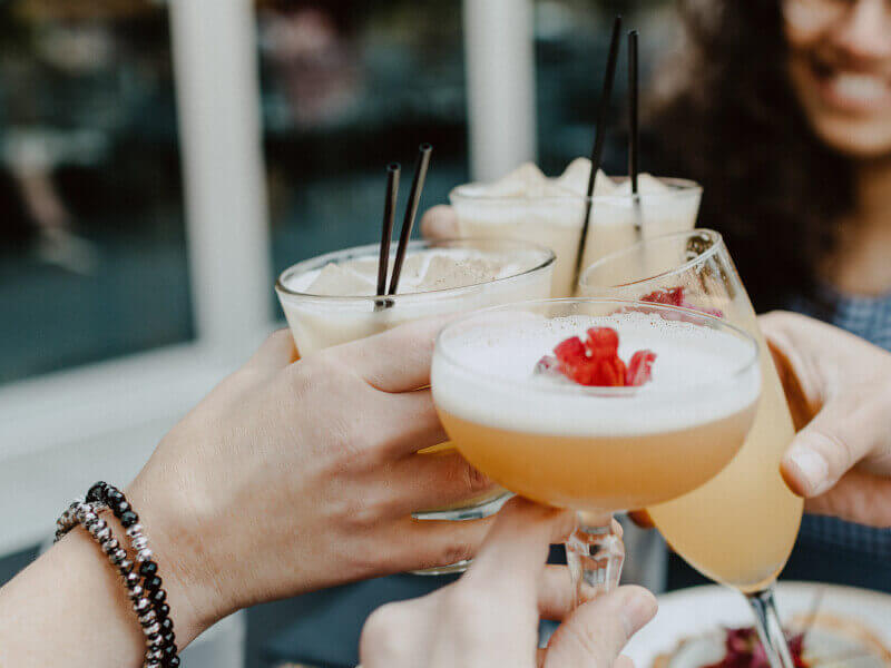 A group of people enjoying summer cocktails 