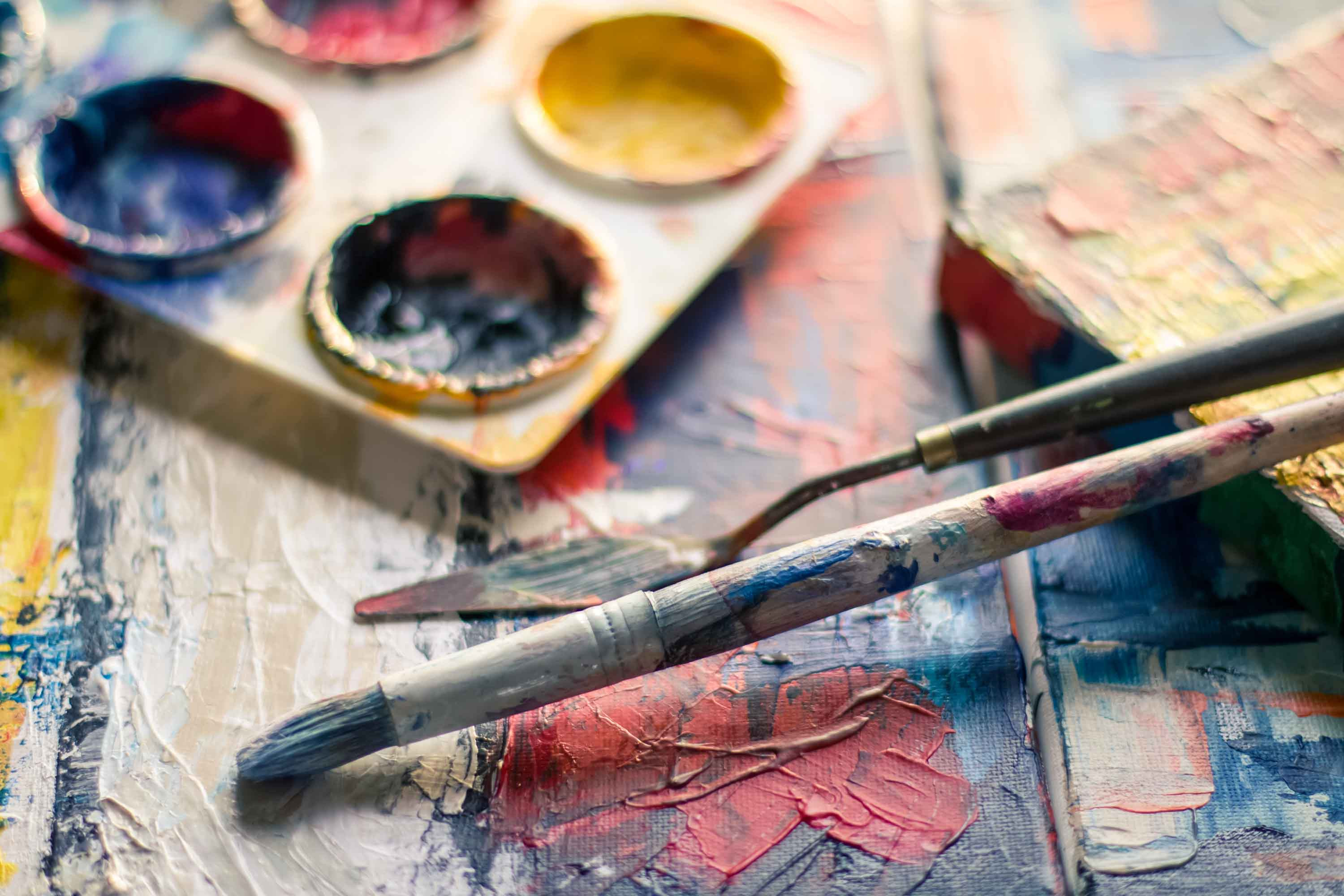 Art equipment covered in colourful dried paint