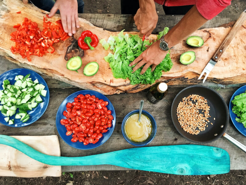 Ingredients for an online cooking class - bright vegetables and herbs.