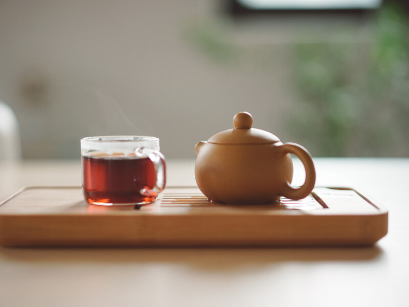 A cup of calming tea sat on a table.