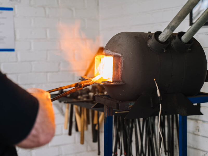 A forge with fire and tools