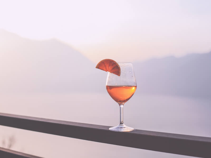 Spritz from a DIY cocktails class. A mountain range silhouette is behind.