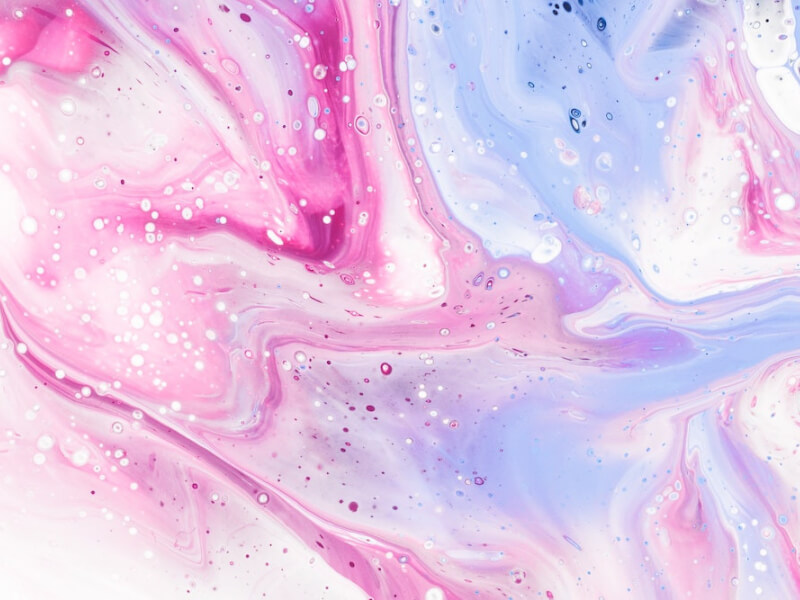 A purple, pink and white artwork of poured paint.