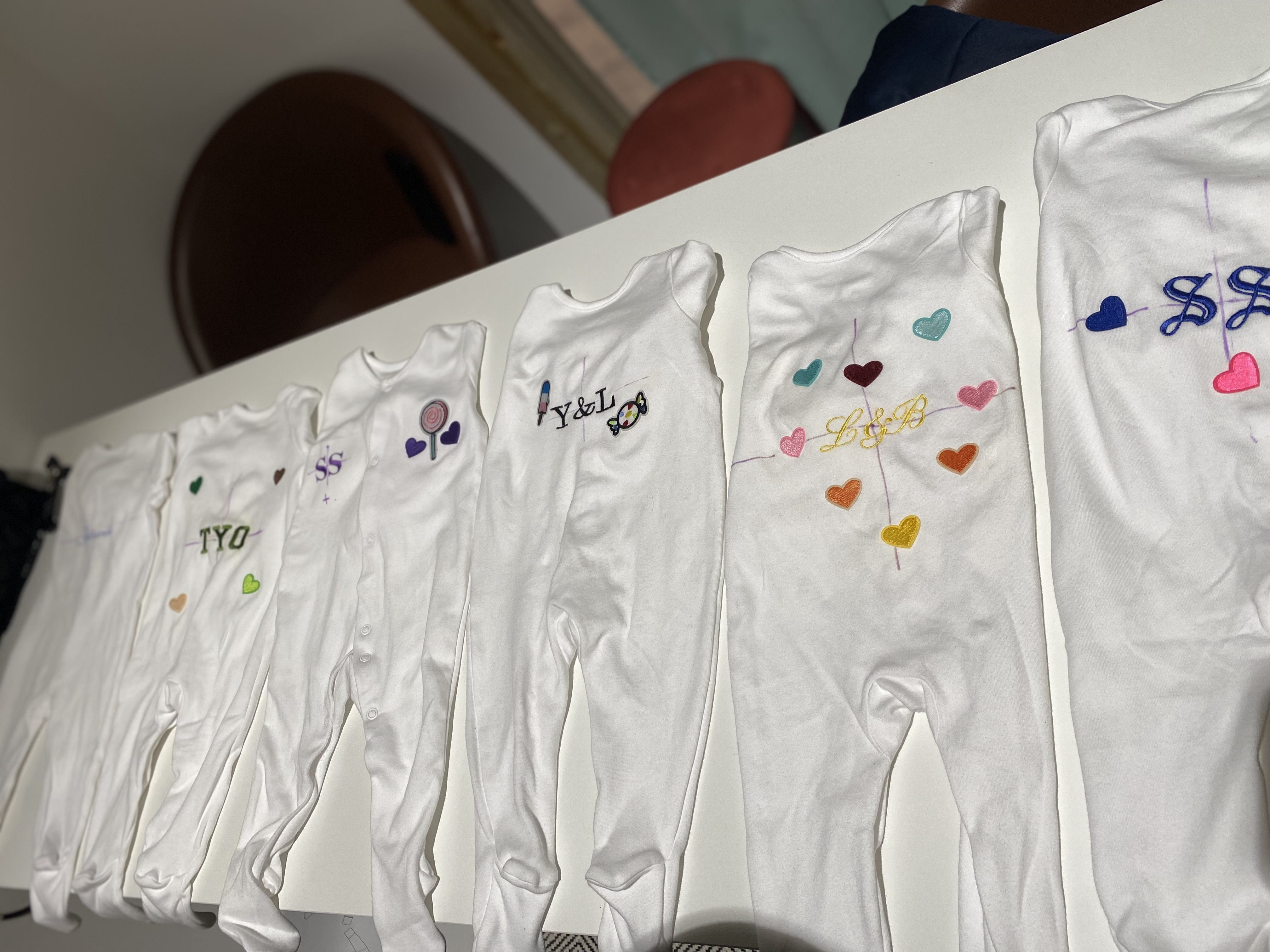 Personalised baby grows in a row