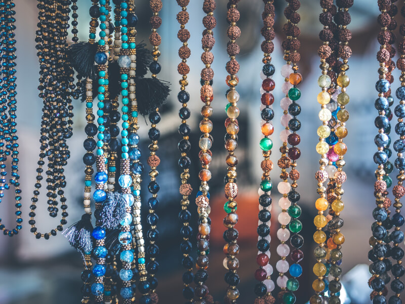 Colourful bead necklaces on display after a DIY jewellery making class.