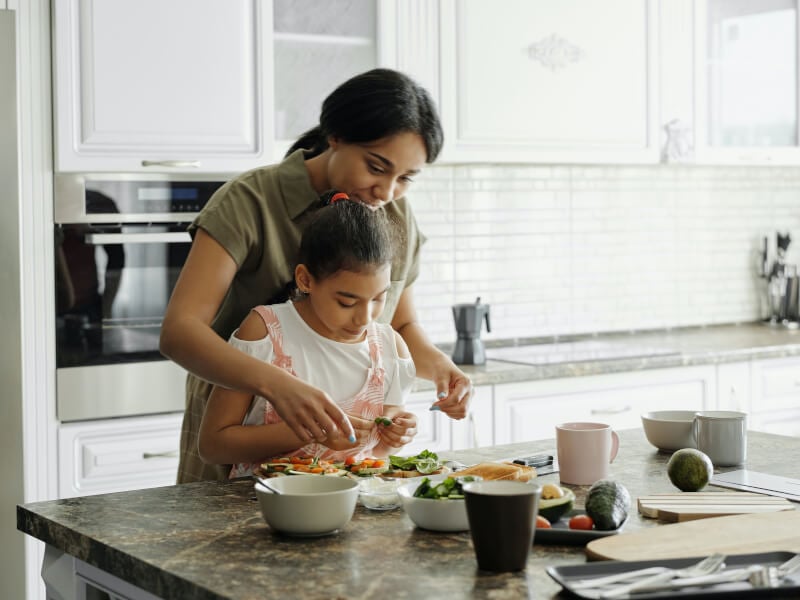 A family preparing and cooking a meal