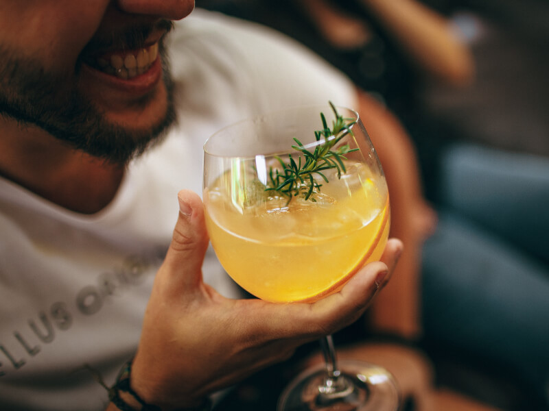 A person enjoying a cocktail 