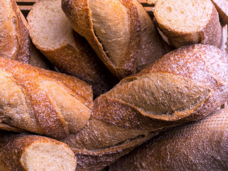 A basket of homemade bread baguettes.