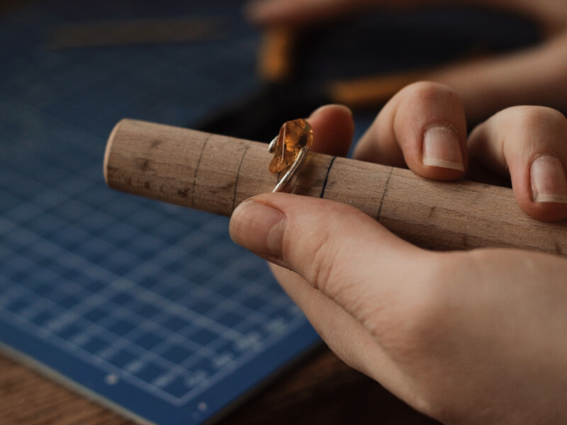A closeup of a DIY ring being sized.