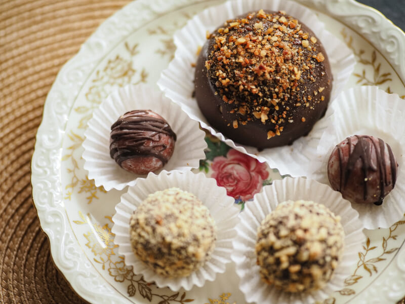 Homemade chocolate truffles in paper casings.